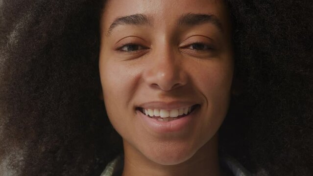African American Female Portrait. African American woman smiling looking at camera. Slow motion.