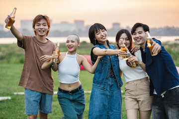 Image of group of friends celebrating and drinking beer together