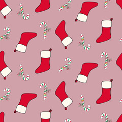 Seamless pattern with Christmas red stockings and candy canes on isolated red background. Holiday design for Christmas home decor, holiday greetings, Christmas and New Year celebration. 