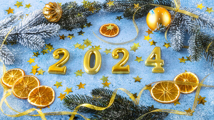 New Year background with golden numbers 2024, Christmas decoration on snowy blue background.