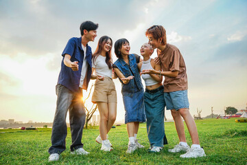 Naklejka premium Image of a group of young Asian people laughing happily together