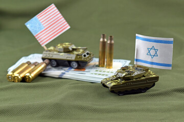 A battle tank with the Israeli flag on a background of US dollar banknotes.
