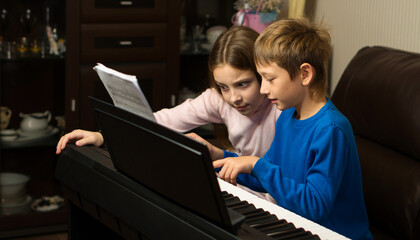 Siblings Sharing Piano Moments
