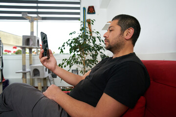 Casual Man on Sofa Having a Video Call