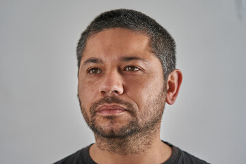 Neutral Backdrop Frames the Focused Man