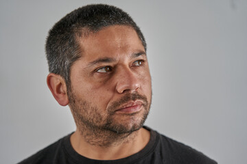 Fototapeta premium Focused Male Subject Against a Plain Background