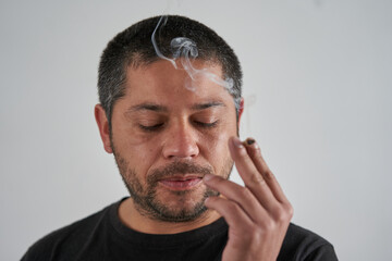 Man Puffing on a Cigarette, White Background