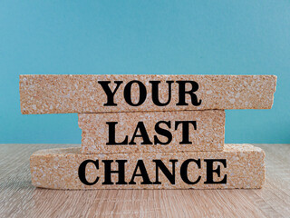 Time to your last chance symbol. Concept words Your last chance on brick blocks on a beautiful...