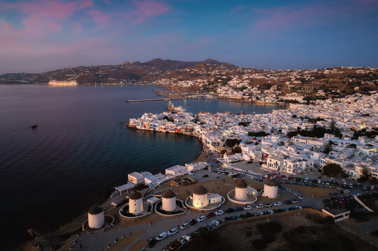 A stunning Mykonos vista: White houses against a breathtaking sea backdrop, a picture of Greek island paradise.