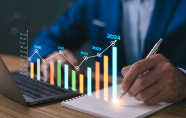 2024 business financial plan market concept, performance of profit growth on 2023 to 2024, education trend up finance on growth graph money revenue, Businessman analyzes profitability of working. - obrazy, fototapety, plakaty