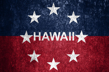 Close-up of the grunge Hawaii state flag. Dirty Hawaii state flag on a metal surface.