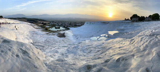 Visitors of Pamukkale, its pools, terraces, white texture and wide angle views