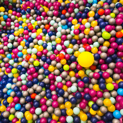 Soft plastic balls in children's playroom to protect children from injury.