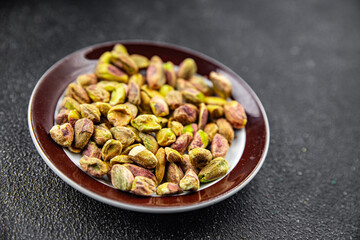 pistachios peeled without shell nut healthy eating cooking appetizer meal food snack on the table...