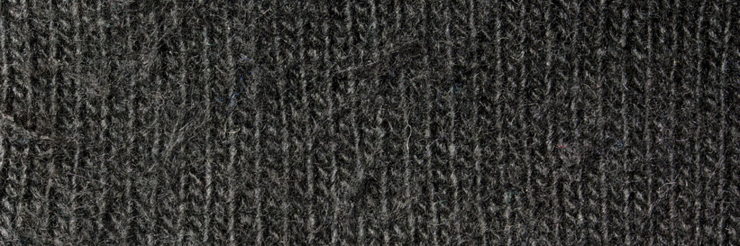 The texture of black woolen fabric