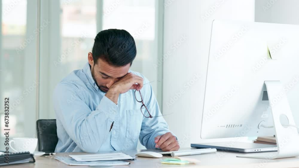 Poster tired and stressed man with a headache sitting alone at his desk inside an office. exhausted busines