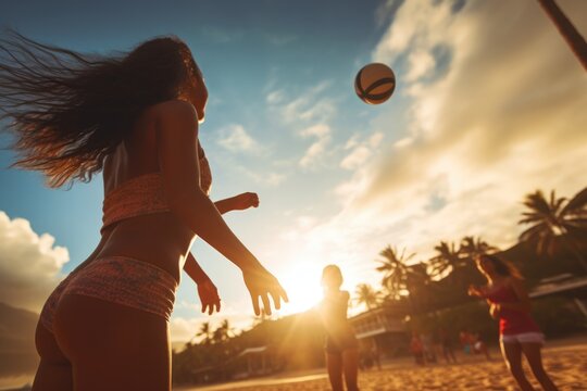 Beautiful girl close-up view in a sand beach volleyball game at sunset. Summer tropical vacation concept.