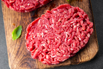ground meat raw cutlet fresh beef meat hamburger eating cooking appetizer meal food snack on the table copy space food background rustic top view