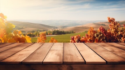 Naklejka na ściany i meble Wooden table in an autumn evening landscape with free space on the table for simulating product display. Winery and wine tasting concept