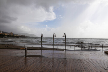 storm surge seen from behind the showers arranged on the bathhouse during the flood that occurred...