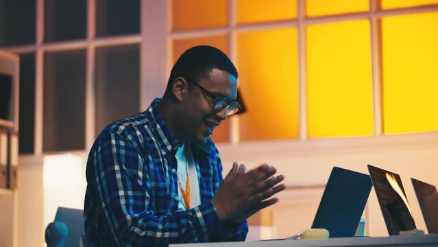 IT engineer happy with successful project completion, gesturing yes and smiling