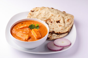 Paneer Butter Masala or Cheese Cottage Curry served with tandoori roti