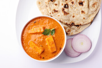 Paneer Butter Masala or Cheese Cottage Curry served with tandoori roti