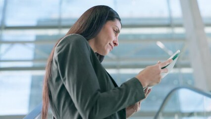 Tablet, consultant and serious woman with research, internet scroll and typing email. Technology, reading and professional working on online project, app or website for networking in business lobby