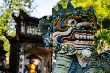 Detailed, blue-green dragon statue at the Thien Tru Temple near the Perfume Pagoda in Hanoi.