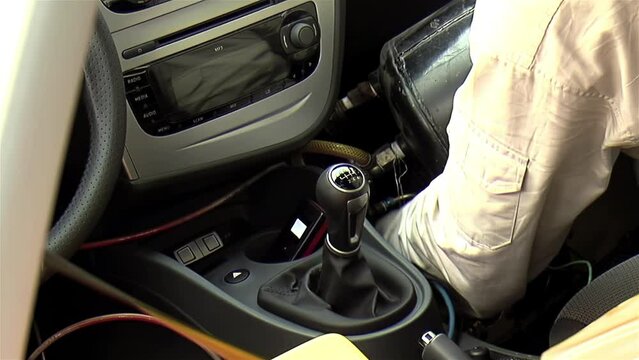 Crash Testing with Remote Setup, Technician Holding Remote Control While Preparing A Crash Test inside Vehicle. Close Up.