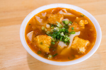 Noodles with tomato soup with green onion