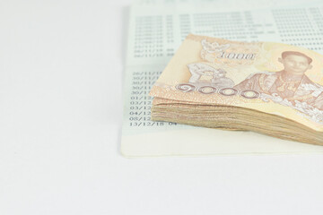 Businessman holding Thai banknotes money on white background.
