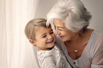 A Beautiful Bond: A Smiling and Happy Mature Lady Creates Cherished Moments with Her Joyful Grandson, Reflecting the Love, Affection, and Generational Connection in Their Heartwarming Relationship