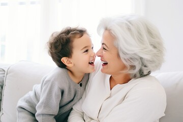 Celebrating Family: A Smiling and Happy Mature Lady Shares Joyful Moments with Her Grandson, Creating Precious Memories Filled with Love, Laughter, and Generational Connection