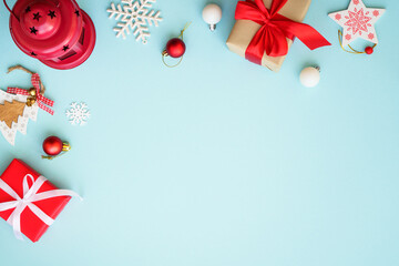 Christmas background. Christmas present boxes and holiday decorations at blue. Flat lay image with copy space.