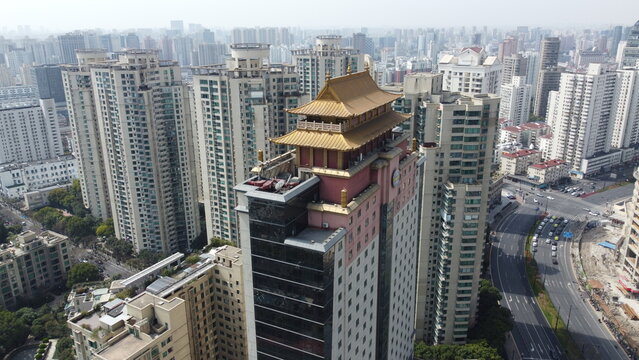 In XuJiaHui, Shanghai, a church and pagoda stand against the skyline, symbols of spiritual diversity.