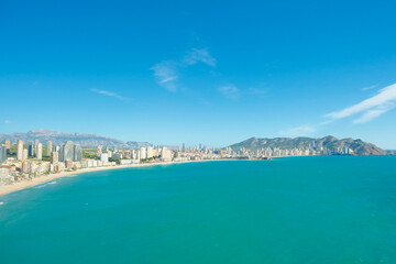 Naklejka na ściany i meble Aerial view to turquoise Mediterranean sea and Benidorm resort, Poniente beach, Alicante province, Spain