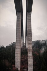 Stark architectural scene of a large bridge with several tall concrete pillars in Austria, Carinthia