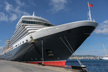 Classic british luxury ocean liner cruiseship cruise ship in port with detail view of steel hull,...