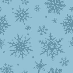 Naklejka na ściany i meble Winter seamless pattern with snowflakes on a blue background. Vector Christmas ornament