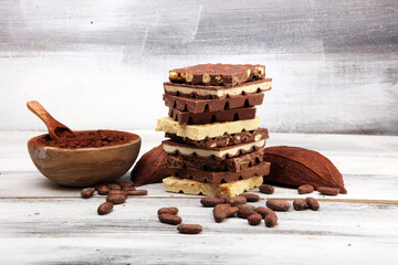 Chocolate bars on white background with chocolate tower