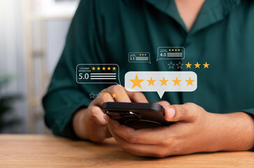 Online customer satisfaction survey feedback and ratings for business success, business people use smartphone Touch the happy smiley icon, 5 stars. rating to service experience on online application.