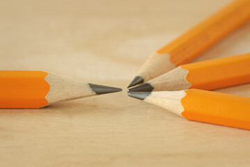 One pencil facing group of pencils - Concept of leadership, defiance or confrontation