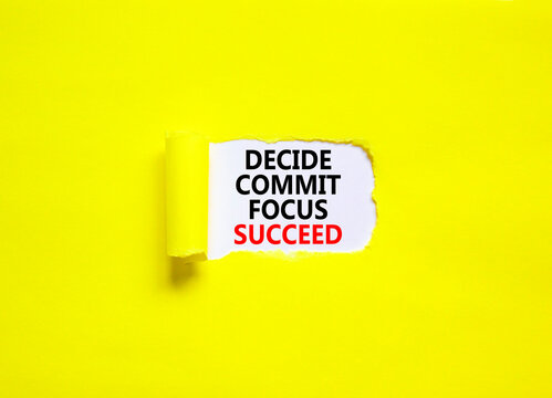 Decide commit focus succeed symbol. Concept word Decide Commit Focus Succeed on beautiful white paper. Beautiful yellow paper background. Business decide commit focus succeed concept. Copy space.