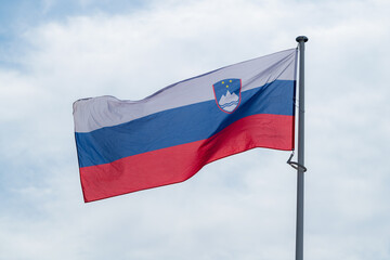 The national flag of Paraguay waving in the blue sky