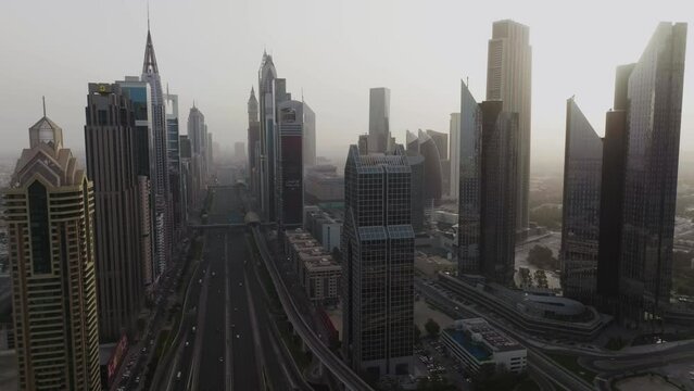 Aerial dolly shot showing Sheikh Zayed Road, Dubai, United Arab Emirates 