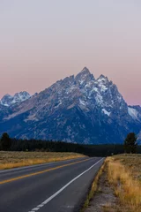 Fotobehang Tetongebergte Vertical image of the Cathedral Group mountains in Grand Teton National Park with snow during fall