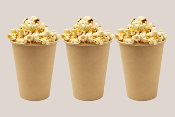 Collage with popcorn in a glass on a white background