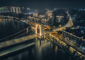 Fototapeta premium Night View of Hongguang Bridge and bulidings in Liuzhou, Guangxi, China, Asia