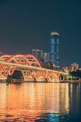 Obraz premium Scenic view of Wenhui Bridge with its bright night illumination. Liuzhou, China.